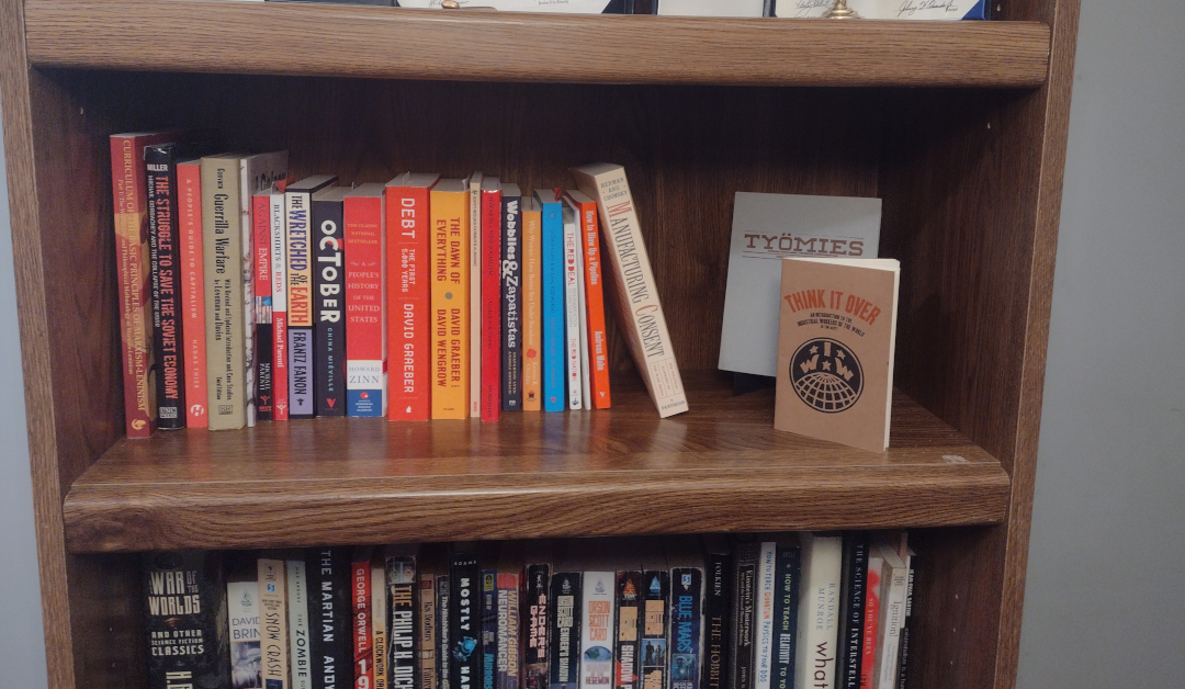 picture of several books of leftist theory on a bookshelf